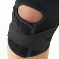 Medical Knee Brace Support With Cross Strap For Sports & Injury Support Adjustable Compression Support With Bi-directional Strap For Soft Tissue Protection - Black
